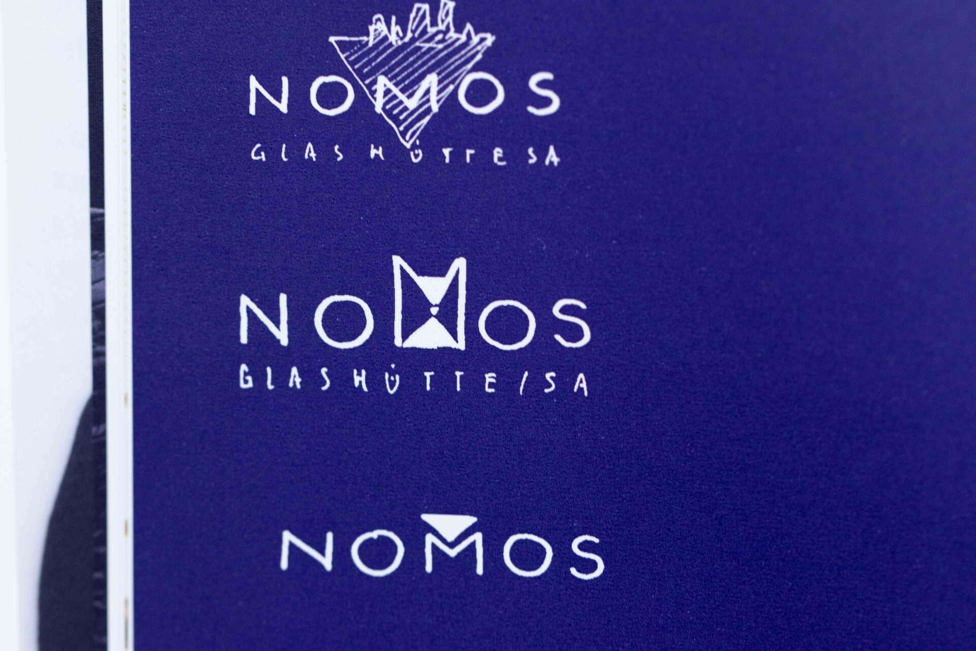 Nomos Glashütte Logo