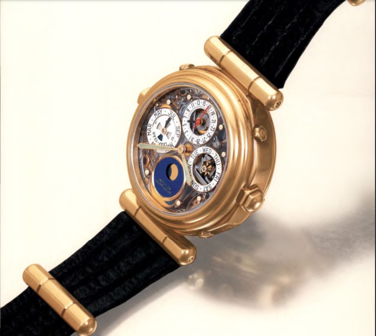 Montre en or Gérald Genta à cadran squeletté avec calendrier perpétuel et phase de lune